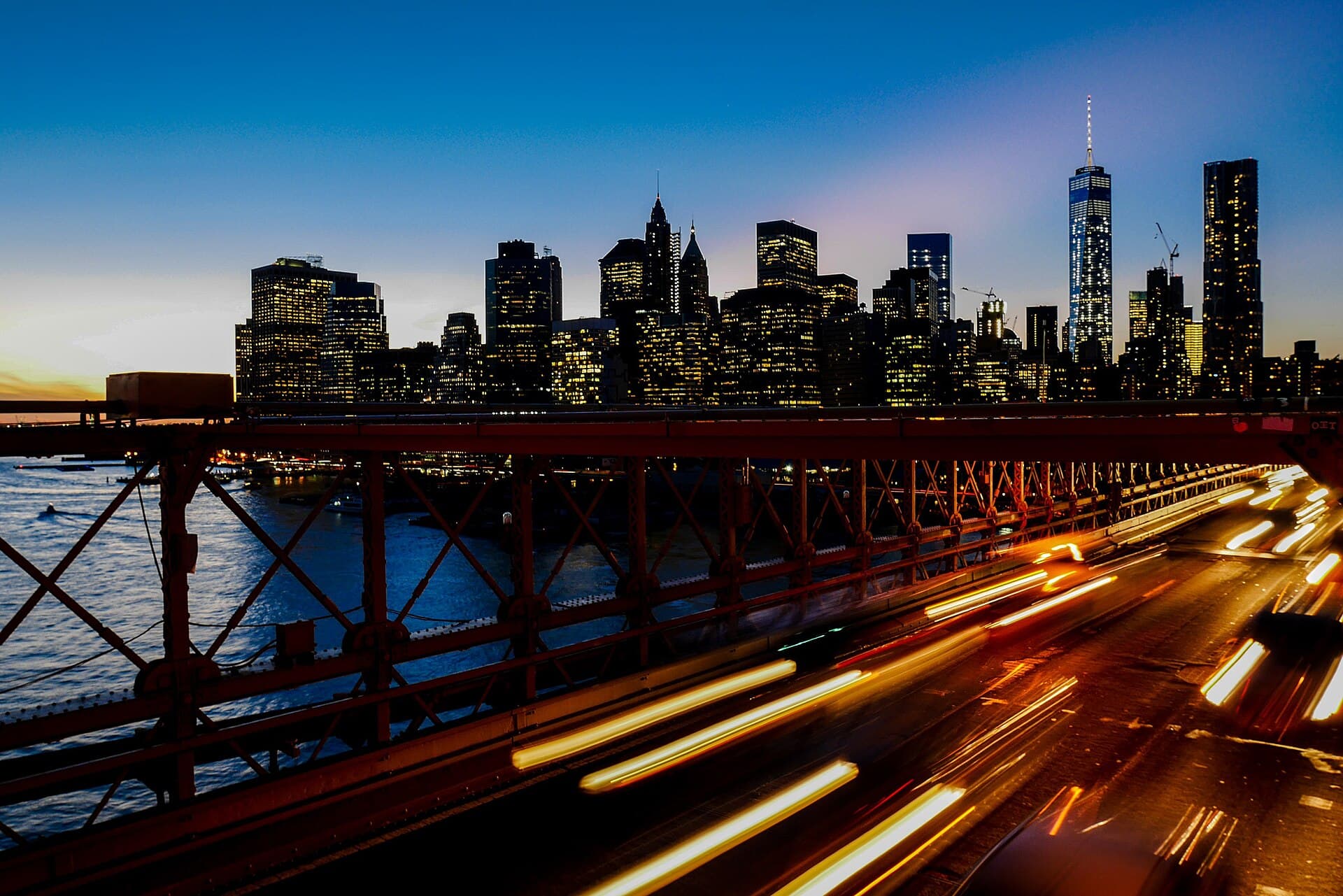 New York skyline at dusk with light trails along the waterfront